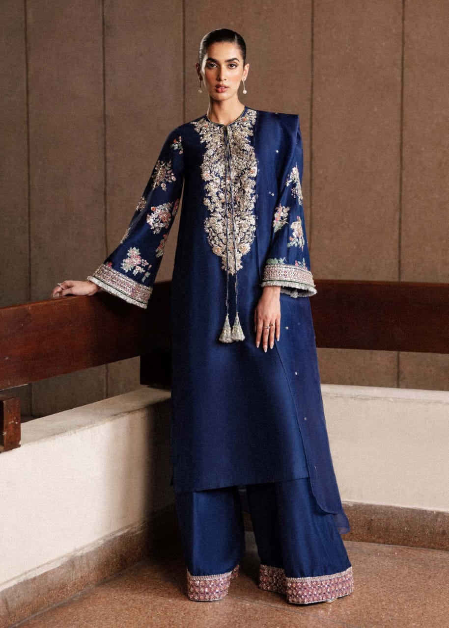 Classic Navy Blue Raw Silk Long Shirt with Silver Nakshi, Sequins & Multicolor Cut Dana Embellishments, Heavily Embellished Sleeves, Paired with Red Raw Silk Palazzo Pants and Organza Dupatta – Luxury 3-Piece Formal Ensemble