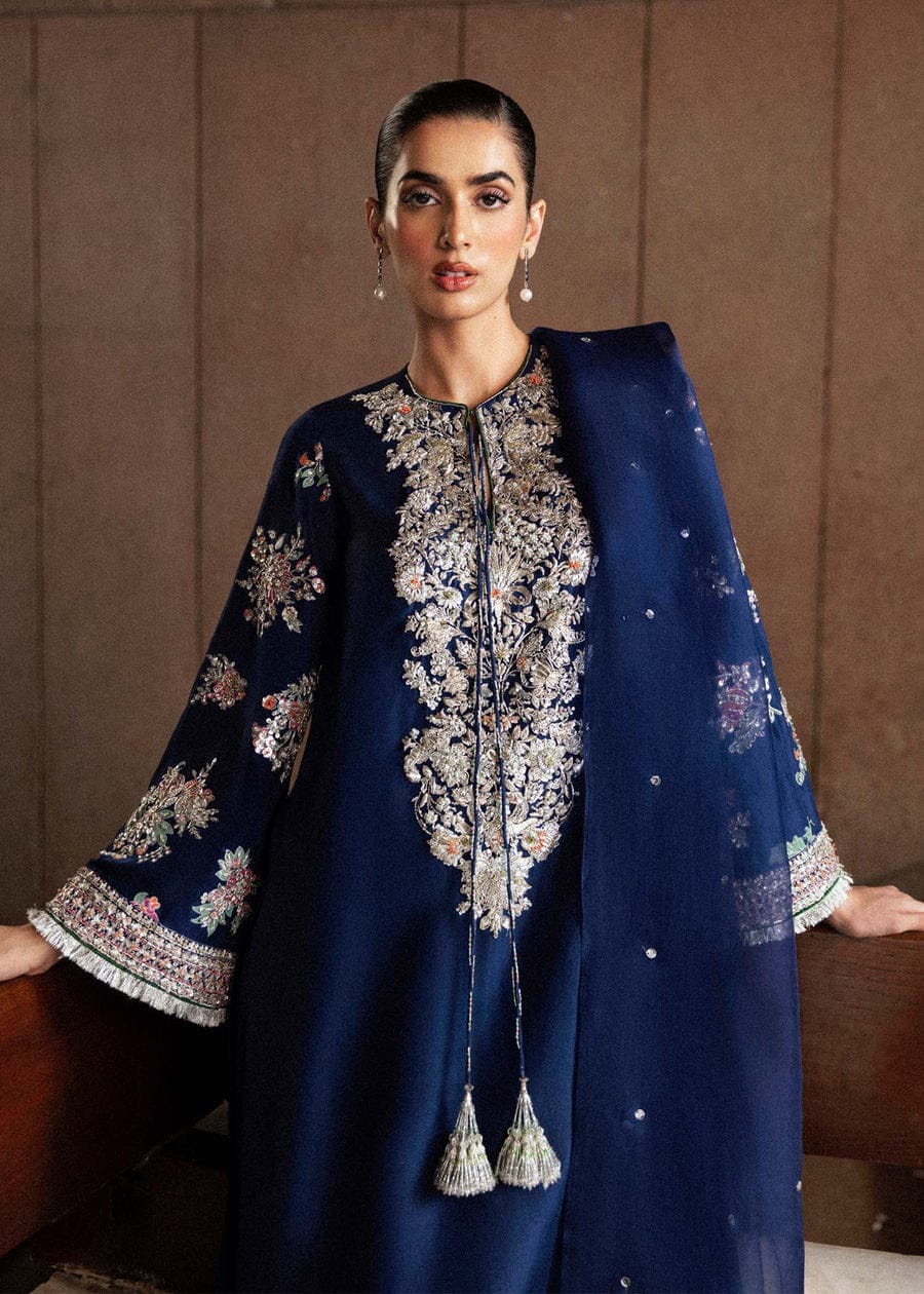 Classic Navy Blue Raw Silk Long Shirt with Silver Nakshi, Sequins & Multicolor Cut Dana Embellishments, Heavily Embellished Sleeves, Paired with Red Raw Silk Palazzo Pants and Organza Dupatta – Luxury 3-Piece Formal Ensemble